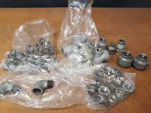 lot 2119 image: Lot of (48) Steel Pipe Fittings - (24) 1 Plugs, (2) 34 Street Elbows, (13) 1 Bushings, (7) 1 x 1 x 12 Tees, (2) 1 Unions