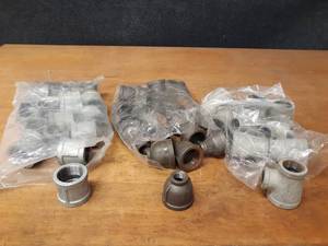 lot 2129 image: Lot of (50) Steel Pipe Fittings - (24) 1-14 x 12 Reducers, (9) 1-14 x 1 x 34 Reducing Tees, (17) 1-14 Couplers