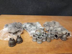 lot 2132 image: Lot of (61) Steel Pipe Fittings - (23) 1 45° Street Elbows, (24) 1 Couplers, (14) 1-14 x 12 Reducing Couplers