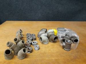 lot 2136 image: Lot of (35) Steel Pipe Fittings - (9) 1-14 x 34 x 1-14 Tees, (7) 1-12 x 1-14 90° Elbows, (9) 1-14 45° Street Elbows, (10) 1-14 Bushings