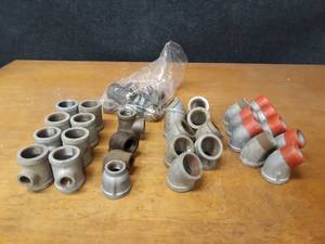 lot 2137 image: Lot of (38) Steel Pipe Fittings - (8) 1-14 x 12 x 1-14 Tees, (9) 1-14 45° Elbows, (9) 1-14 45° Street Elbows and More