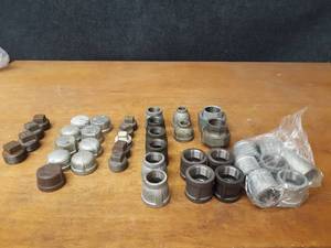 lot 2141 image: Lot of (39) Steel Pipe Fittings - (11) 1-14 Couplers, (2) 1-14 Unions, (6) 1-14 x 1 Reducers, (2) 1-14 x 12 Reducers, (5) 1-14 Plugs, (9) 1-14 Caps, (4) 1-12 Plugs