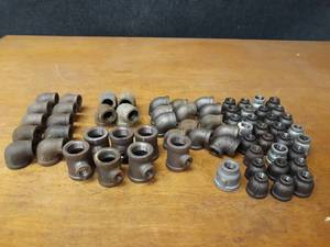 lot 2142 image: Lot of (64) Steel Pipe Fittings - 1 & 34 Elbows, Tees, Reducers
