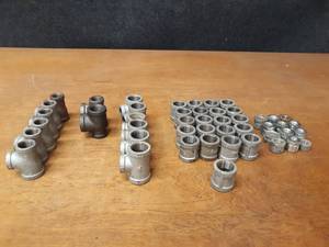 lot 2143 image: Lot of (47) Steel Pipe Fittings - 34 Elbows, Tees, Couplers and Bushings