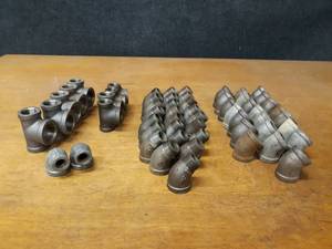 lot 2144 image: Lot of (57) Steel Pipe Fittings - 34 Elbows, Tees & Street Elbows