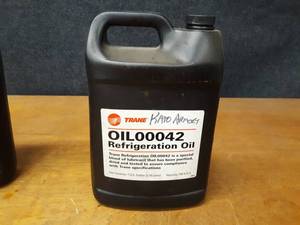 lot 2166 image: NEW 1 Gallon Jug TRANE Refrigerant Oil Part No. OIL00042