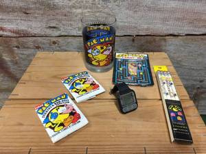 lot 40 image: Vintage Pac-Man Watch, Stickers, Glass, Games