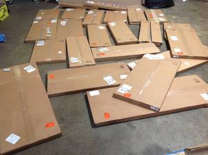 lot 25 image: Lot of assorted Closet  Evolution wood shelves not used see pictures