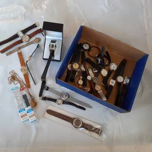 lot 311 image: Large lot of mens and womens wrist ...