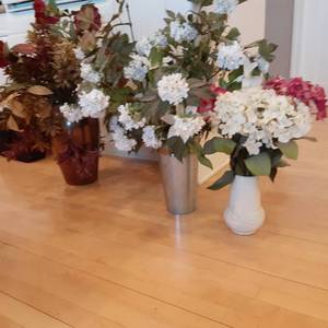 lot 384 image: Faux Floral arrangements each in th...