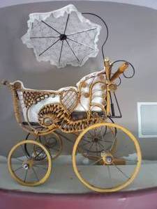 lot 42 image: Decorative Wicker Buggy With Umbrel...