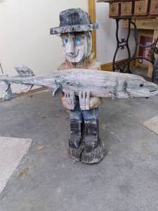 lot 223 image: Large Outdoor Wood Fisherman Statue...