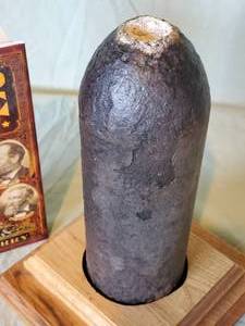 lot 32 image: (1) Civil War Book & Artillery Round