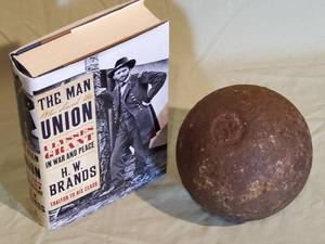 lot 91 image: (1) Civil War Book & (1) Massive Civil War Cannon Ball