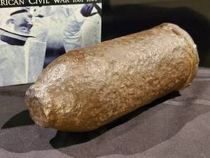 lot 246 image: Civil War Excavated Armour Piercing 20# Bottlenose Parrot Bolt with Fuse Brass & Civil War Book
