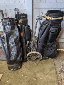 lot 136 image: (3) Golf Bags and Push Cart