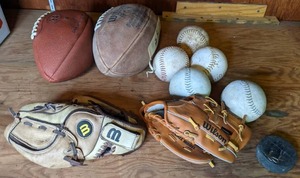 lot 107 image: Footballs, Softballs, Baseball Gloves, Hockey Puck