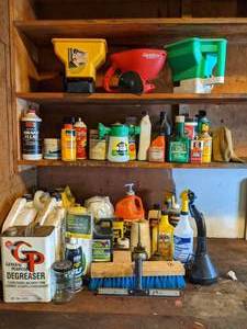 lot 91 image: Contents of Garage Shelves Seed Spreaders, Car Wax, Oil, Washer Fluid, Degreaser, etc.