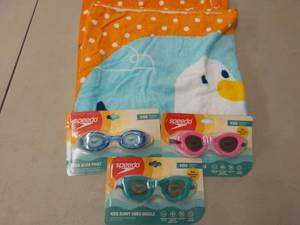 lot 46 image: Beach Towels and Kids Goggles...