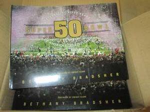 lot 262 image: case of 10 superbowl 50 paper back ...