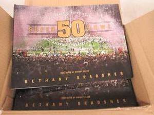 lot 264 image: case of 10 superbowl 50 paper back ...