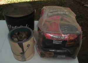 lot 18 image: Two bags charcoal, bucket, gas gril...