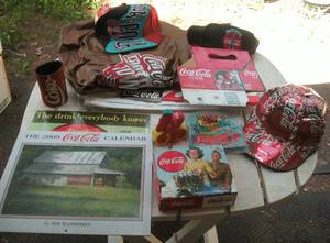 lot 121 image: Coca Cola calendars, hats, inflatab...