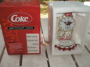 lot 123 image: Coca Cola anniversary clock...