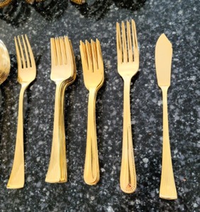 Gold Tone Flatware and Napkin Rings