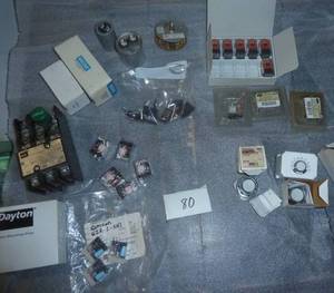 lot 80 image: group of new Omron relays, timer, pushbutton switches, motor brushes, capacitors, starter