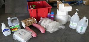 lot 109 image: Red Tote full of bathroom supplies, hand sanitizer, toilet paper and tissue, cleaning rags, spill contain, cleaner
