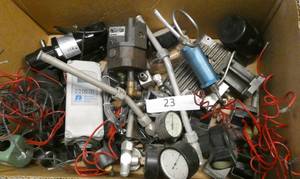 lot 23 image: Box of misc gauges, small bodine motor, moog motor, John Barnes motor solenoid coils and temperature control