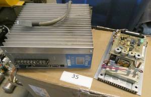 lot 35 image: Spare Bell & Howell folder board and an Actus Controller