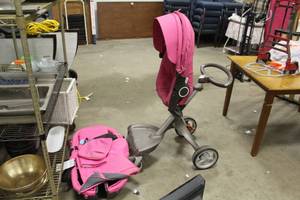 lot 657 image: Stokke 3-Wheel Stroller Pink  with Carters Diaper Bag