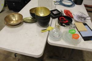 lot 663 image: Lot of  Kitchen & Dishware - Decorative Metal Bowls with Hammered Finish, Glass Plates, Glass Bowls, Cutting Boards (plastic and wood), Juicer