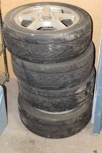 lot 669 image: Lot of (4) Ford Mustang SVT 16 4-lug Rims with P20550R16 Tires