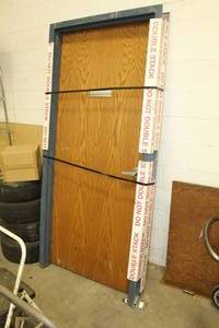 lot 673 image: Wood Door  with Metal Frame
