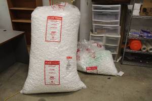 lot 678 image: Lot of (2 Bags) Packing Peanuts (one appears full, one is partial)