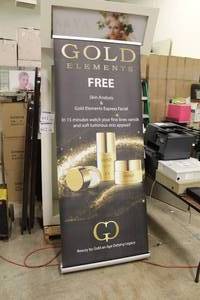 lot 735 image: Retractable Display  with logo Gold Elements 34Wx84H
