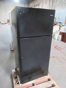 Frigidaire 18 cu. ft. Top Freezer Refrigerator in Black. FFTR1814TB. - Slight Dent on Bottom LH Back Side.