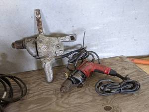 lot 125 image: Milwaukee and Black & Decker Drills - Both Powered On