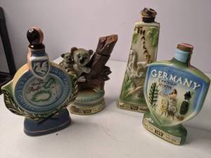 lot 35 image: Beautiful Collection of (4) Vintage Porcelain Jim Beam Decanters