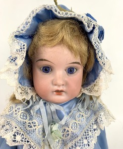 lot 10 image: Antique Bisque-Head Doll (Repaired) w Cloth Covered Body, Blue Satin Outfit, 13 Tall