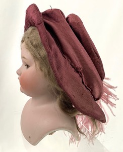 lot 11 image: Large Simon Halbig 1080 Bisque Shoulder Head Doll Head w Light Brown Wig and Burgundy Hat, 8 Tall
