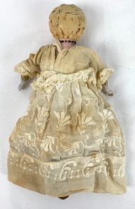 lot 12 image: Antique Minerva Metal Head Doll, 11.5 Tall