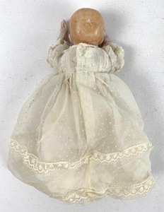 lot 13 image: Antique Porcelain Infant Doll (No Legs) in Long Ivory Gown, 4 Tall