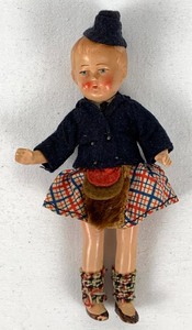 lot 21 image: A Pair of German Bisque Scottish Highlander Dolls, 5.25 Tall.