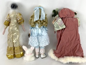 lot 99 image: Three Collectible Porcelain Dolls -2 by Brinns- Bunnie, Santa and Girl in Gold Lame