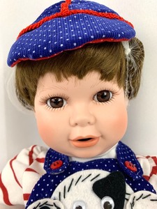 lot 115 image: World Gallery Porcelain Doll - Benjamin by Vincent De Filippo