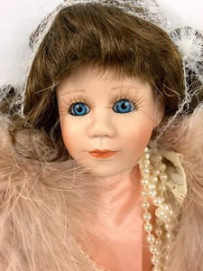 lot 137 image: World Gallery Porcelain Doll - Genna by Margie Costa